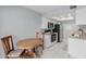 Cozy dining area adjacent to the kitchen with an electric range and stainless steel appliances at 520 N Stapley Dr # 117, Mesa, AZ 85203