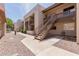 Attractive condo building with metal stairs, balconies, and a well-maintained exterior and walkway at 520 N Stapley Dr # 117, Mesa, AZ 85203