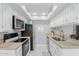 Kitchen features a skylight, stainless appliances, and light countertops at 520 N Stapley Dr # 117, Mesa, AZ 85203