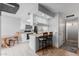 Efficient kitchen with a breakfast bar, modern appliances, and seamless connection to the dining area at 520 N Stapley Dr # 117, Mesa, AZ 85203