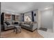 Cozy living room featuring comfortable sofas, a stylish coffee table, and lots of natural light at 520 N Stapley Dr # 117, Mesa, AZ 85203