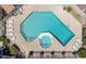 Aerial view of the community pool with lounge chairs and a hot tub at 520 N Stapley Dr # 117, Mesa, AZ 85203