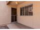 Welcoming front porch with a secure door and a window offering a glimpse into the home's interior at 520 N Stapley Dr # 117, Mesa, AZ 85203