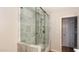 Modern bathroom featuring a glass-enclosed shower with marble tile and sleek fixtures at 524 W Fairway Dr # 10, Mesa, AZ 85201