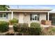 Charming home exterior featuring a well-manicured front yard and inviting covered porch at 524 W Fairway Dr # 10, Mesa, AZ 85201