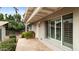 Inviting view of home exterior with a tile patio, lush landscaping, and a cozy, welcoming entrance at 524 W Fairway Dr # 10, Mesa, AZ 85201