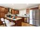 Well-lit kitchen features stainless steel appliances, a kitchen island, and white countertops at 524 W Fairway Dr # 10, Mesa, AZ 85201