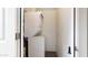 Laundry room showcasing stacked washer and dryer inside white doorframe at 524 W Fairway Dr # 10, Mesa, AZ 85201