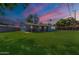 Expansive backyard with lush lawn and covered patio, perfect for outdoor entertaining and relaxation at 6121 N 11Th St, Phoenix, AZ 85014