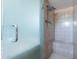 Refreshed walk-in shower featuring a seat and updated shower head in this private bathroom at 6121 N 11Th St, Phoenix, AZ 85014