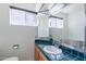 Cozy bathroom showcasing an eye-catching teal tiled countertop and a large mirror at 6121 N 11Th St, Phoenix, AZ 85014