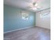 Comfortable bedroom offering updated floors, neutral paint, and lots of natural light from the two large windows at 6121 N 11Th St, Phoenix, AZ 85014