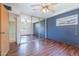 Charming bedroom with wood laminate floors, mirrored closet, and large window for ample natural light at 6121 N 11Th St, Phoenix, AZ 85014