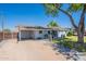Attractive home featuring a carport, covered patio, and beautifully paved walkway to the front entrance at 6121 N 11Th St, Phoenix, AZ 85014