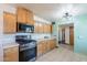 Eat-in kitchen with stainless steel appliances and light wood cabinets at 6121 N 11Th St, Phoenix, AZ 85014