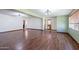 Open-concept living room with hardwood flooring and neutral paint at 6121 N 11Th St, Phoenix, AZ 85014