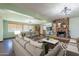 Inviting living room features a stone fireplace, modern furnishings, and an open floor plan to the dining area at 6121 N 11Th St, Phoenix, AZ 85014