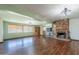 Cozy living room featuring a stone fireplace and hardwood floors at 6121 N 11Th St, Phoenix, AZ 85014