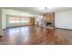 Spacious living room featuring a stone fireplace, hardwood floors, and built-in bookshelves at 6121 N 11Th St, Phoenix, AZ 85014