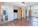 Spacious main bedroom features wood laminate flooring, ceiling fan, and mirrored closet doors for ample storage at 6121 N 11Th St, Phoenix, AZ 85014