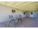 Covered patio area features a table and chairs for outdoor relaxation and entertaining at 6121 N 11Th St, Phoenix, AZ 85014