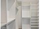 Organized walk-in closet with ample shelving and storage space for clothing and accessories at 6623 E Marisa Ln, Phoenix, AZ 85054