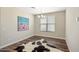 Simple dining area with rustic art, wood floors, and natural light at 6623 E Marisa Ln, Phoenix, AZ 85054