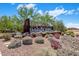 Landscaped entrance to Paradise Ridge with native plants and desert foliage surrounding the community sign at 6623 E Marisa Ln, Phoenix, AZ 85054