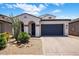 Charming single-story home with a well-manicured front yard and two-car garage at 6623 E Marisa Ln, Phoenix, AZ 85054
