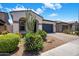 Charming home with desert landscaping, a paver driveway, and a covered front porch at 6623 E Marisa Ln, Phoenix, AZ 85054
