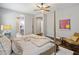 Serene main bedroom featuring a ceiling fan and a view of the en-suite bathroom at 6623 E Marisa Ln, Phoenix, AZ 85054