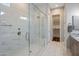 Luxurious walk-in shower with glass enclosure, marble tiling, and modern fixtures for a spa-like experience at 6623 E Marisa Ln, Phoenix, AZ 85054