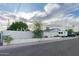 View of the back of the home with a truck and RV, offering a glimpse of the property's layout at 7255 E Coronado Rd, Scottsdale, AZ 85257
