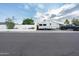 A truck and camper parked in a home's driveway, showcasing ample parking space at 7255 E Coronado Rd, Scottsdale, AZ 85257