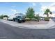 Well-maintained home featuring desert landscaping and a large black truck parked in the driveway at 7255 E Coronado Rd, Scottsdale, AZ 85257