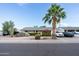 Charming single-story home featuring manicured landscaping and a mature palm tree in the front yard at 7255 E Coronado Rd, Scottsdale, AZ 85257