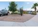 Front yard featuring desert landscaping, a mature tree, and a decorative cactus at 7255 E Coronado Rd, Scottsdale, AZ 85257