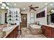 Elegant bathroom with double sinks, soaking tub, glass shower, and marble countertops at 7751 E Golden Eagle Cir, Gold Canyon, AZ 85118