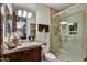 Bathroom featuring a large walk-in shower, plus a vanity with a decorative mirror at 7751 E Golden Eagle Cir, Gold Canyon, AZ 85118