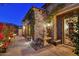 Beautiful courtyard with a stone fountain and lush landscaping creating a private oasis at 7751 E Golden Eagle Cir, Gold Canyon, AZ 85118