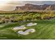 Scenic view of a lush golf course with sand traps and mountains in the background at 7751 E Golden Eagle Cir, Gold Canyon, AZ 85118