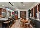 Open kitchen with island seating, custom cabinets, and an adjacent dining area at 7751 E Golden Eagle Cir, Gold Canyon, AZ 85118