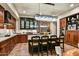 Well-appointed kitchen with a large island, custom cabinetry, and modern appliances at 7751 E Golden Eagle Cir, Gold Canyon, AZ 85118