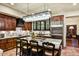 Spacious kitchen featuring dark wood cabinets, a large island and stainless steel appliances at 7751 E Golden Eagle Cir, Gold Canyon, AZ 85118