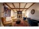 Cozy living room featuring a fireplace, built-in bookshelves, and stylish decor and warm lighting at 7751 E Golden Eagle Cir, Gold Canyon, AZ 85118