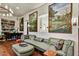 Elegant living room featuring neutral decor, hardwood floors, piano, stylish light fixture and wall decor at 7751 E Golden Eagle Cir, Gold Canyon, AZ 85118
