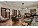 Bright living room showcasing a fireplace, decorative chandelier, and comfortable seating arrangement at 7751 E Golden Eagle Cir, Gold Canyon, AZ 85118