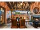 Picturesque outdoor dining with fireplace and view of the surrounding landscape at 7751 E Golden Eagle Cir, Gold Canyon, AZ 85118