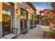 Enchanting outdoor patio with stone wall, bougainvillea and plenty of light creating the perfect outdoor space at 7751 E Golden Eagle Cir, Gold Canyon, AZ 85118