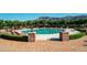 Beautiful outdoor pool area with lounge chairs, manicured landscaping, and stunning mountain views at 7751 E Golden Eagle Cir, Gold Canyon, AZ 85118